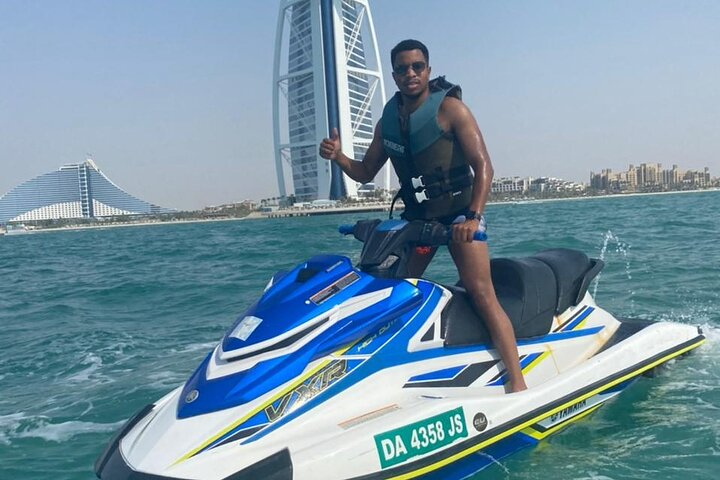 Experience the rush of gliding over sparkling waters with the iconic Jumeirah skyline as your backdrop perfect for an adventurous escape on a jet ski in Dubai.